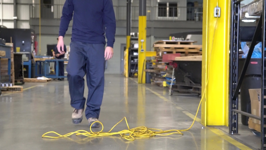 An industrial occupational health and safety topic. Slips, trips and falls are a leading cause of workplace injury. | Shutterstock HD Video #1084645582