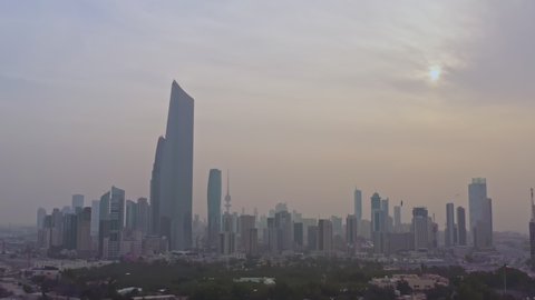 Kuwait City, Kuwait - February 24, 2020: Aerial view of Kuwait City financial district in sunrise fog.
