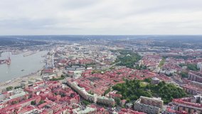 Inscription on video. Gothenburg, Sweden. Panorama of the city and the river Goeta Elv. The historical center of the city. Cloudy weather. Name is burning, Aerial View