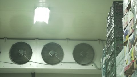 Refrigerators fan in a industrial food large cold storage refrigerator. Slow Motion