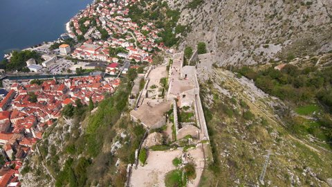 Aerial shot of the fortress St John San Giovanni over the Old Town of Kotor, the famous tourist spot in Montenegro.