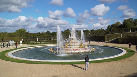 Versailles, France - October 10, 2020: Latona Fountain in the Gardens of Versailles with unidentified visitors in the background.