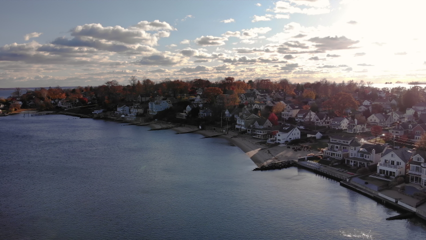Beachfront houses and autumn leaves in Stamford, CT at golden hour (drone shot)