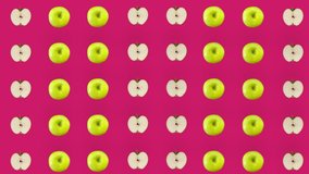 Colorful fruit pattern of fresh apples on pink background. Seamless pattern with apple sliced. Realistic animation. 4K video motion