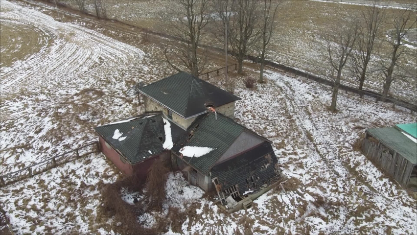 Aerial Shot Of An Abandoned House In Ruins, Creepy Homestead In Farm Field