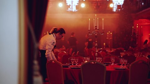 Nizhny Novgorod, December 10, 2021. Waiters lay out dishes in the banquet hall