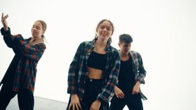 Music Video Clip Montage with Three Young Professional Dancers Performing a Hip Hop Dance Routine in Studio. Stylish Modern Sequence Transitions Done with Split Screens and Other Visual Effects.