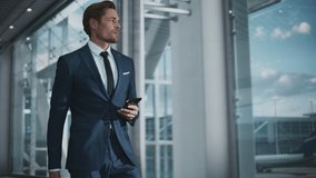 Airport Terminal: Businessman Walks to His Flight Gates, Uses Smartphone, Doing e-Business, Browsing the Internet with App. Digital Entrepreneur Remote Work Online While Traveling Through Airline Hub - Powered by Shutterstock - Get 15% off with code: PIKWIZARD15