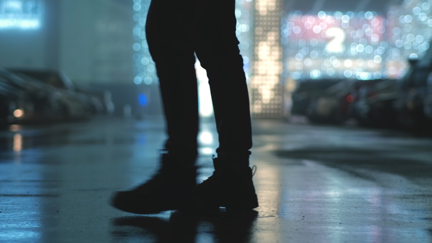 The man walking along the evening street. slow motion | Shutterstock HD Video #1084671715