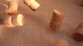 Champagne wine corks fall onto the burlap. Slow motion. - Powered by Shutterstock - Get 15% off with code: PIKWIZARD15