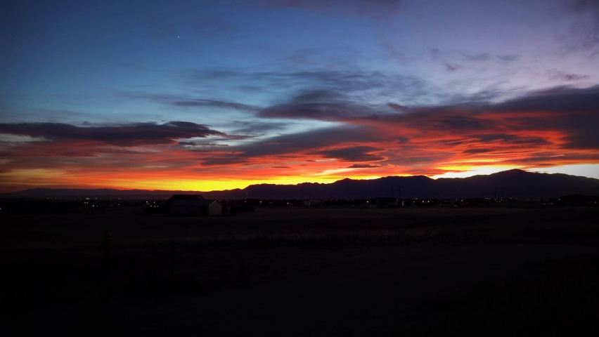 Sunset Over Pikes Peak Colorado Time Lapse 4K features a particularly beautiful sunset over Pikes Peak in the Rocky Mountains shot from the foothills with slight time lapse.