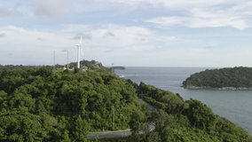 Windmill with seashore, Nai Harn Beach, Phuket Thailand. Drone footage.