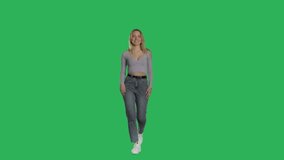 Charming elegant woman with beautiful smile doing presentation and gesturing on green screen background, chroma key. 4k UHD front view isolated video