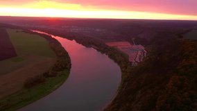 Attractive winding river in sunset from a bird's eye view. Location place Dnister canyon of Ukraine, Europe. Cinematic drone shot. Filmed in UHD 4k video. Discover the beauty of earth.