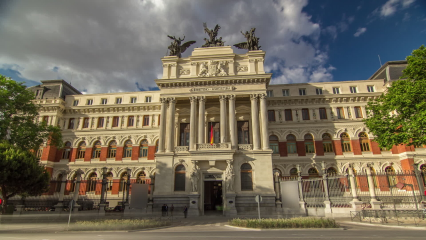 Government palace facade the Ministry of Agriculture building (Ministerio de Agricultura) timelapse hyperlapse with traffic. Placed close to the Atocha railway station in Madrid, Spain.