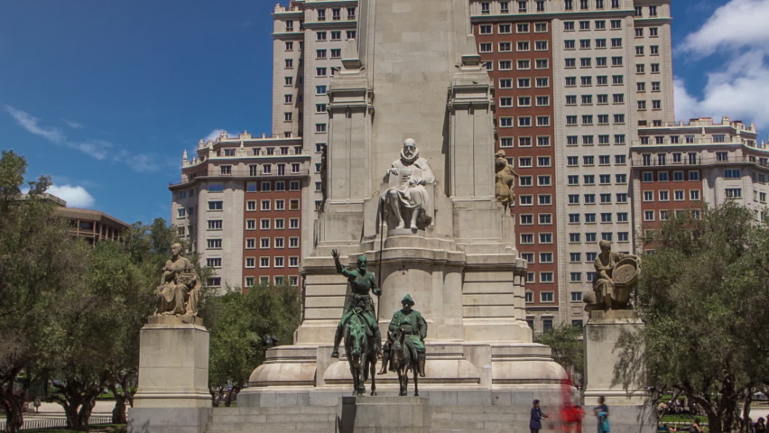 Stone sculpture of Miguel de Cervantes timelapse hyperlapse and bronze sculptures of Don Quixote and Sancho Panza on the Square of Spain (Plaza de Espana). Madrid is a popular tourist destination of