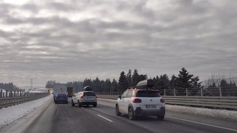 Krzeczow, Poland - December 27, 2021: Slowly driving on Zakopianka road. Traffic jam on the road to Zakopane.
