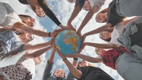 Earth conservation concept. 11 girls hug the earth globe with their hands. - Powered by Shutterstock - Get 15% off with code: PIKWIZARD15