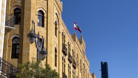 Lebanese flag waving on top of a building in downtown Beirut - Lebanon
- Beirut, Lebanon, December 6, 2021