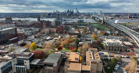 Camden , NJ , United States - 11 29 2021: Rutgers University in Camden NJ. Aerial truck shot on beautiful afternoon. Philly skyline in distance with Ben Franklin Bridge.