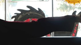 Young man practices kicks in a karate outfit, martial arts fitness conecpt, kicking silhouette - Powered by Shutterstock - Get 15% off with code: PIKWIZARD15