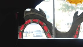 Man in karate outfit practices punches in front of a bright window, silhouette of a martial artist - Powered by Shutterstock - Get 15% off with code: PIKWIZARD15