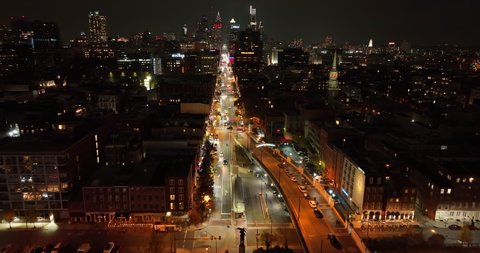 Philadelphia , PA , United States - 11 28 2021: Night view of Market Street in Philadelphia. Christ Church, Wells Fargo, Bourse. Aerial above traffic with cityscape in distance