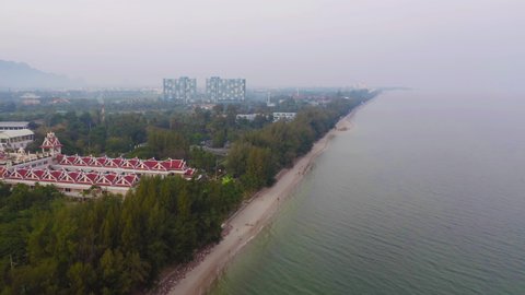 Aerial view of Cha am beach, Thailand island in summer with seawater and tropical green forest trees with Andaman sea in travel trip. Nature landscape.