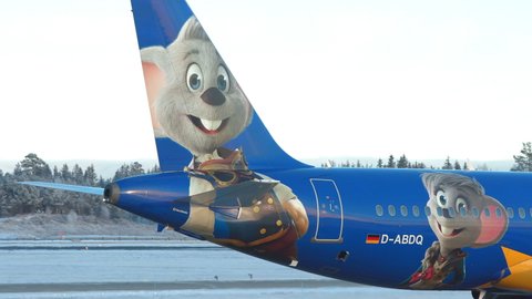 Oslo Airport Norway - December 3 2021: airplane airbus 320 eurowings taxiing europa park logo close view tail
