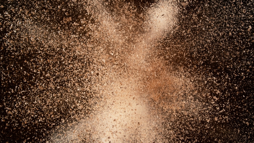 Super Slow Motion Shot of Brown Makeup Powder Explosion Isolated on Black at 1000 fps.