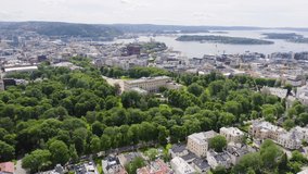 Inscription on video. Oslo, Norway. Royal Palace. Slottsplassen. Palace park. Shimmers in colors purple, Aerial View, Point of interest