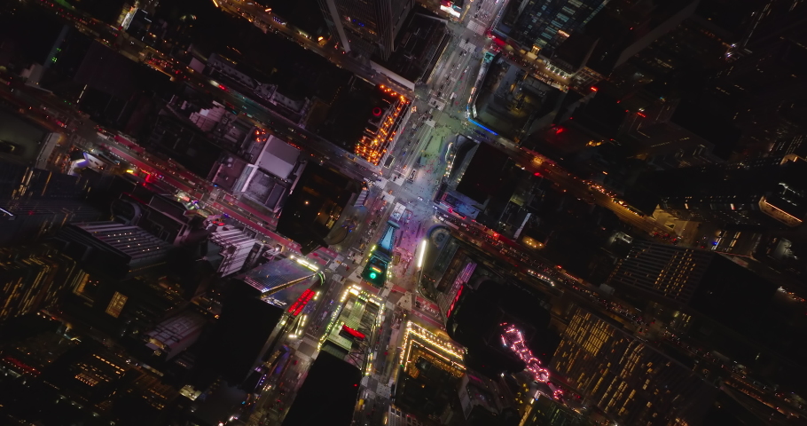 Aerial birds eye overhead top down view of Times Square. Rocket shot of colourfully illuminated visual tourist attraction. Manhattan, New York City, USA Royalty-Free Stock Footage #1084713289