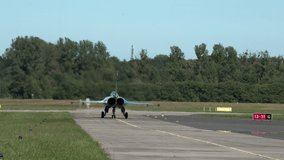 Dassault Rafale fighter jet standing on runway waiting for clearance to take off, heat from engine - Powered by Shutterstock - Get 15% off with code: PIKWIZARD15