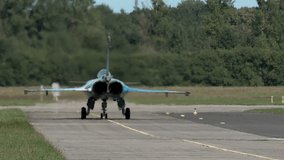 Hot air coming from stationary fighter jet standing on runway, sunny day - Powered by Shutterstock - Get 15% off with code: PIKWIZARD15