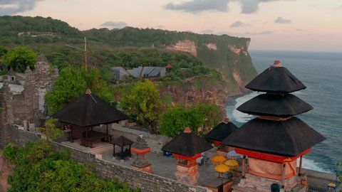 Uluwatu Temple or Pura Luhur Uluwatu is regarded as one of the six most important temples in Bali, Indonesia. 4K Aerial UHD Video clip.