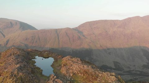 Haystacks. Lake district. England. May. 29. 202`1. Flying over a mountain summit in the morning drone footage