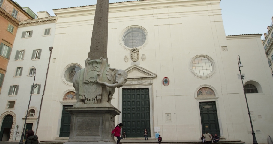 Tilting up shot: Obelisk of Minerva in Rome, Italy. 4k slow motion at 50 fps