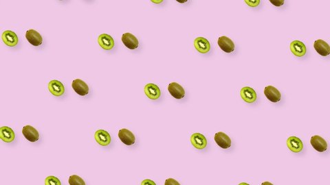 Colorful fruit pattern of fresh rotating kiwi. Seamless pattern with kiwi sliced on pink background. Realistic animation. 4K video motion