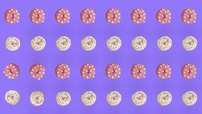 Colorful pattern of donuts isolated on purple background. Seamless pattern with donut. Doughnuts. Top view. Realistic animation. 4K video motion