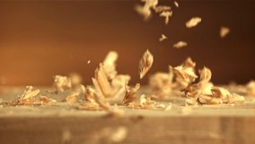 Sawdust falls on the table. Macro background.Filmed is slow motion 1000 fps. High quality FullHD footage