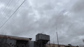 Top of an industrial tin building and fast moving storm clouds creepy scenes in rural Georgia - Powered by Shutterstock - Get 15% off with code: PIKWIZARD15