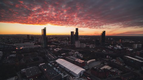 Red Sky, Establishing Aerial View Shot of Manchester, City Skyline, England United Kingdom, track in