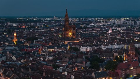Establishing Aerial View Shot of Strasbourg Fr, capital of European Union, Bas-Rhin, France, city at night evening, old town