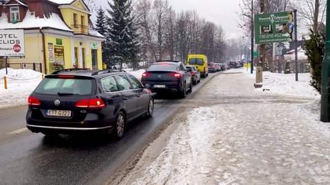 Zakopane, Poland - December 29, 2021: Traffic jam on Nowotarska street in city centre of Zakopane.
