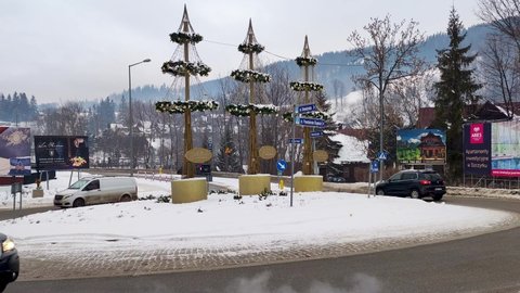 Zakopane, Poland - December 29, 2021: Traffic on Roman Dmowski roundabout.