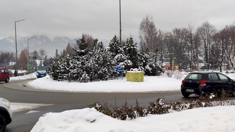 Zakopane, Poland - December 29, 2021: Traffic on Solidarity roundabout in winter time.