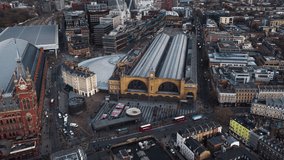 Establishing Aerial View Shot of London UK, United Kingdom, Train station, day circling right high