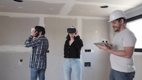 Couple with vr goggles watching virtual project at their new home. 4k video.