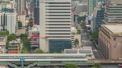 Bangkok, Thailand - 21 Mar 2021: Footage 4k Timelapse of BTS Skytrain at Chidlom station in the Central business district of Bangkok; Sky train is main transport to the center of a commercial zone.