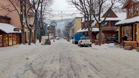 Zakopane, Poland - December 29, 2021: Almost empty Krupowki street in the morning in winter. Popular tourist street in Zakopane.